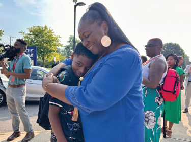 principal hugging student